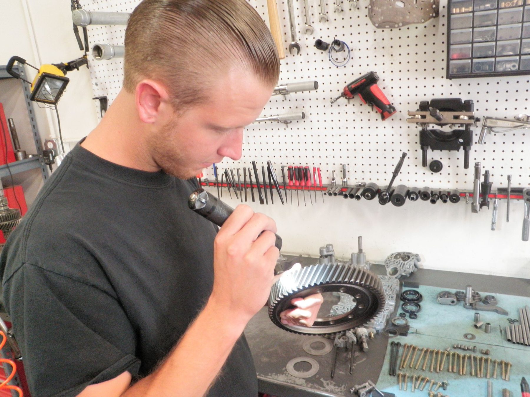 Cleaned Honda transaxle case and valve body with its bolts laid out in order
